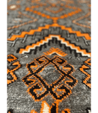 Moroccan Ait Ouaouzguite Wool Rug – 4 ft 8 in × 8 ft, Dark Grey & Orange - Cooperative Atma