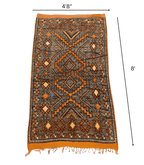 Moroccan Ait Ouaouzguite Wool Rug – 4 ft 8 in × 8 ft, Dark Grey & Orange - Cooperative Atma